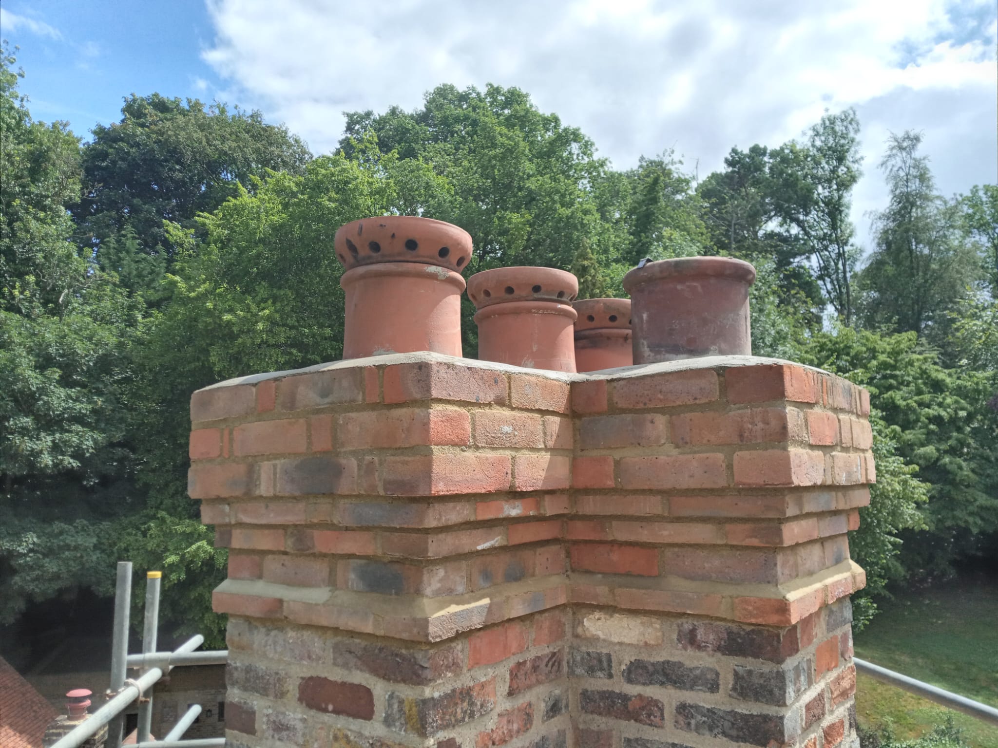 Period chimney stack with terracotta pots